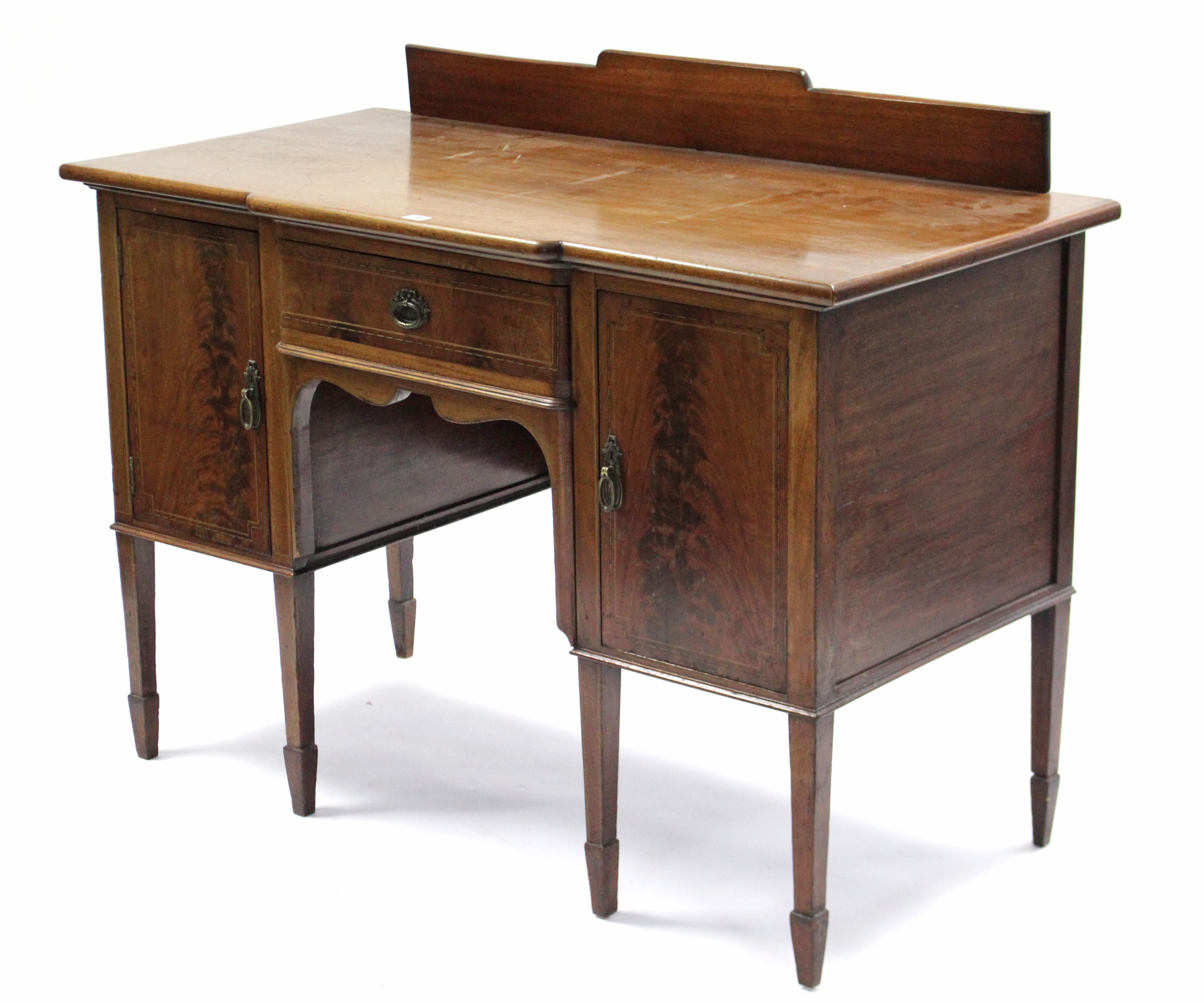 An Edwardian mahogany small break-front sideboard, fitted centre frieze drawer flanked by cupboard