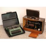 A Singer electric sewing machine; & a Silver-Reed 500 portable typewriter, each with case.