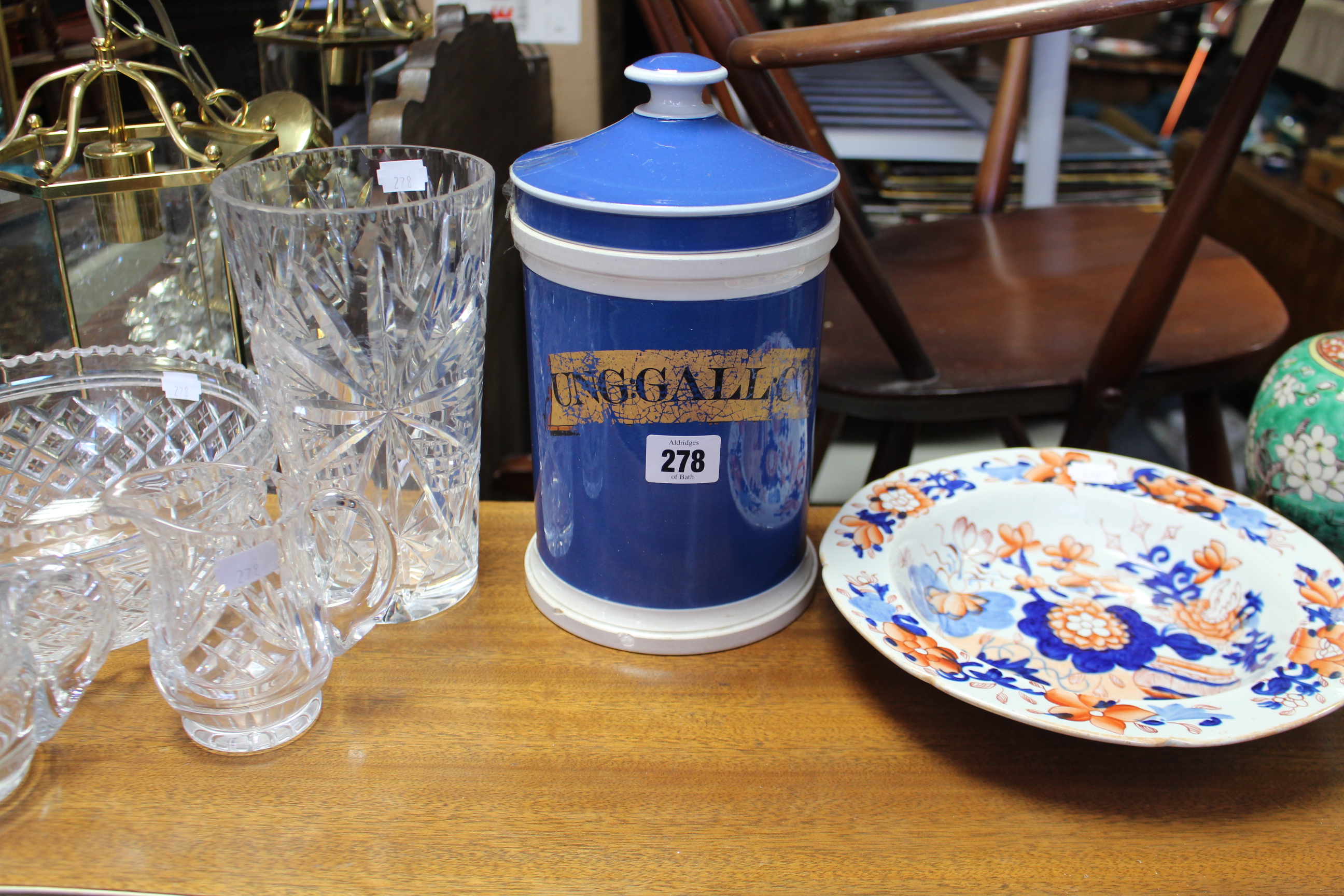 A blue & white glazed ceramic cylindrical apothecary jar “UNG. GALL. CO”, 9½” high; a Mason’s