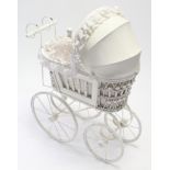 A Victorian style white wicker & wooden painted dolls pram, 24” long.