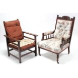 A late Victorian carved mahogany-frame armchair with buttoned back & sprung seat upholstered
