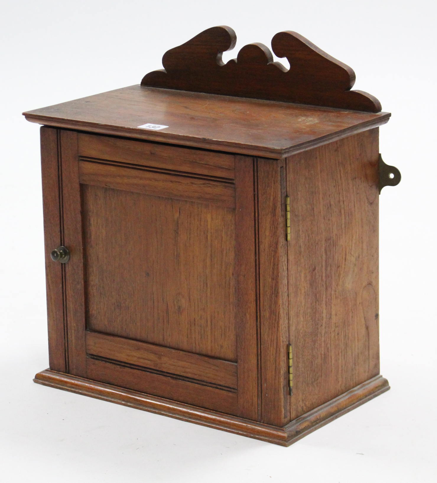 An early 20th century small mahogany wall cabinet, fitted centre shelf enclosed by panel doors,