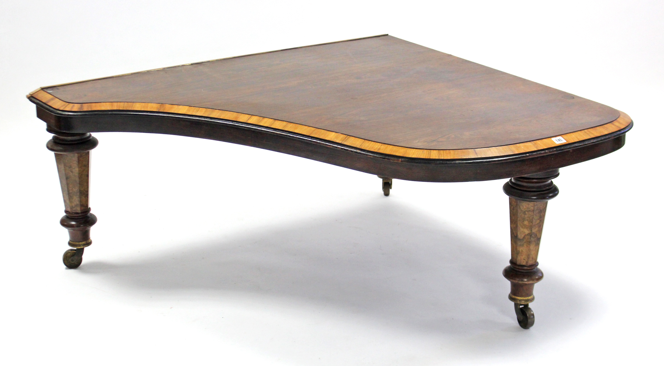 A 19th century mahogany crossbanded low coffee table, (converted from a baby grand piano), with