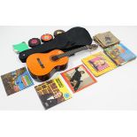 A six-string acoustic guitar, cased; & approximately forty various records.