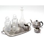 A silver plated embossed three-piece tea service; a similar rectangular two-handled tea tray;