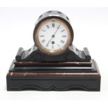 A 19th century mantel timepiece with white enamel dial, & in black slate & red marble case, 9½”