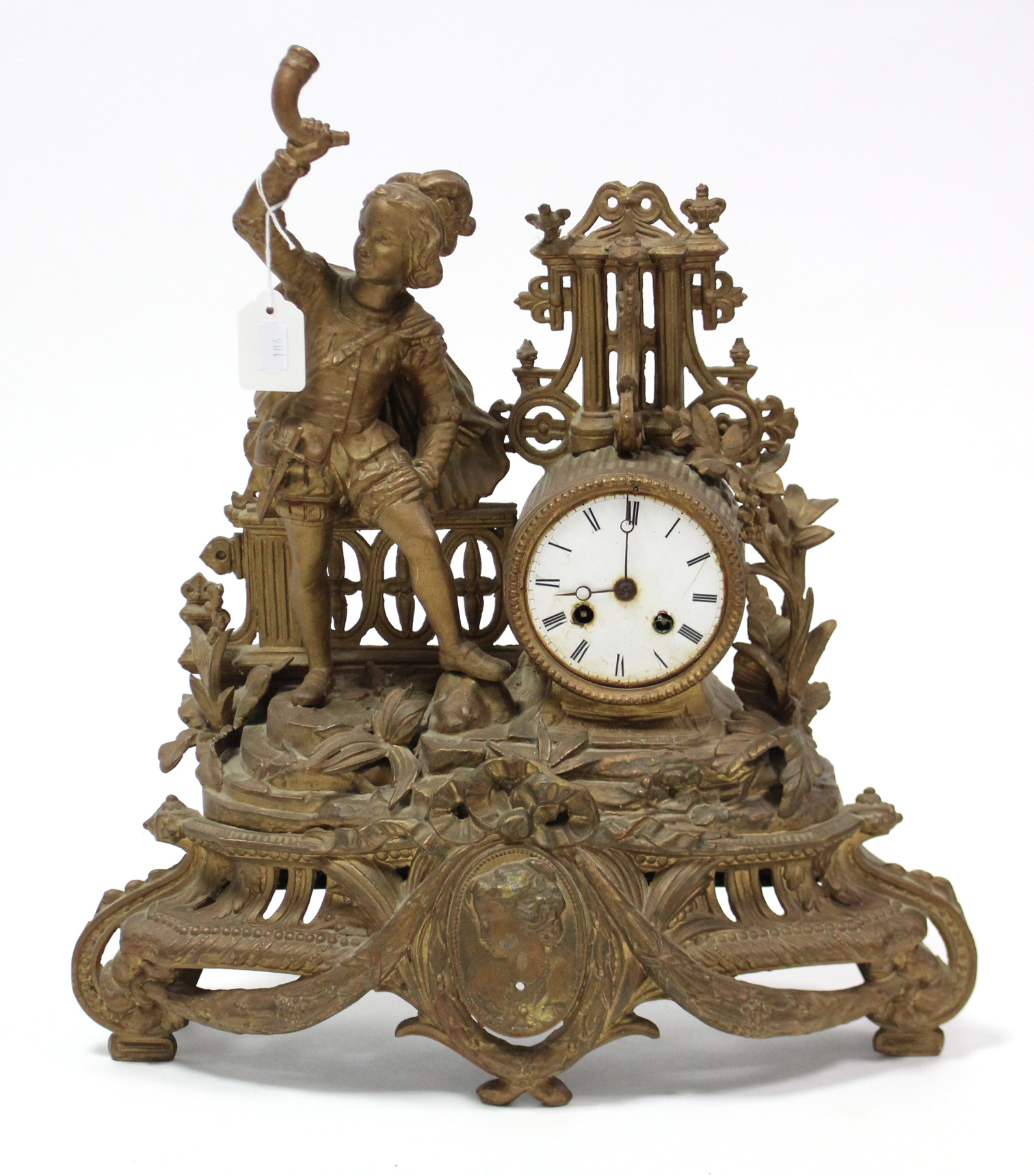 A late 19th century mantel clock with striking movement, white enamel dial, & in gilt ormolu case