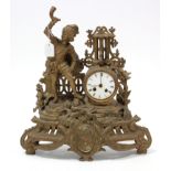 A late 19th century mantel clock with striking movement, white enamel dial, & in gilt ormolu case