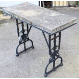 A Biglam’s black painted cast-iron garden table with shaped & pierced end supports, & with stone