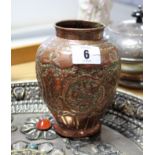 A Copper ovoid vase with embossed floral design, 5½” high; an eastern silvered-metal circular