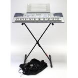 A Casio “CTK-591” keyboard with stand; & two pairs of headphones.