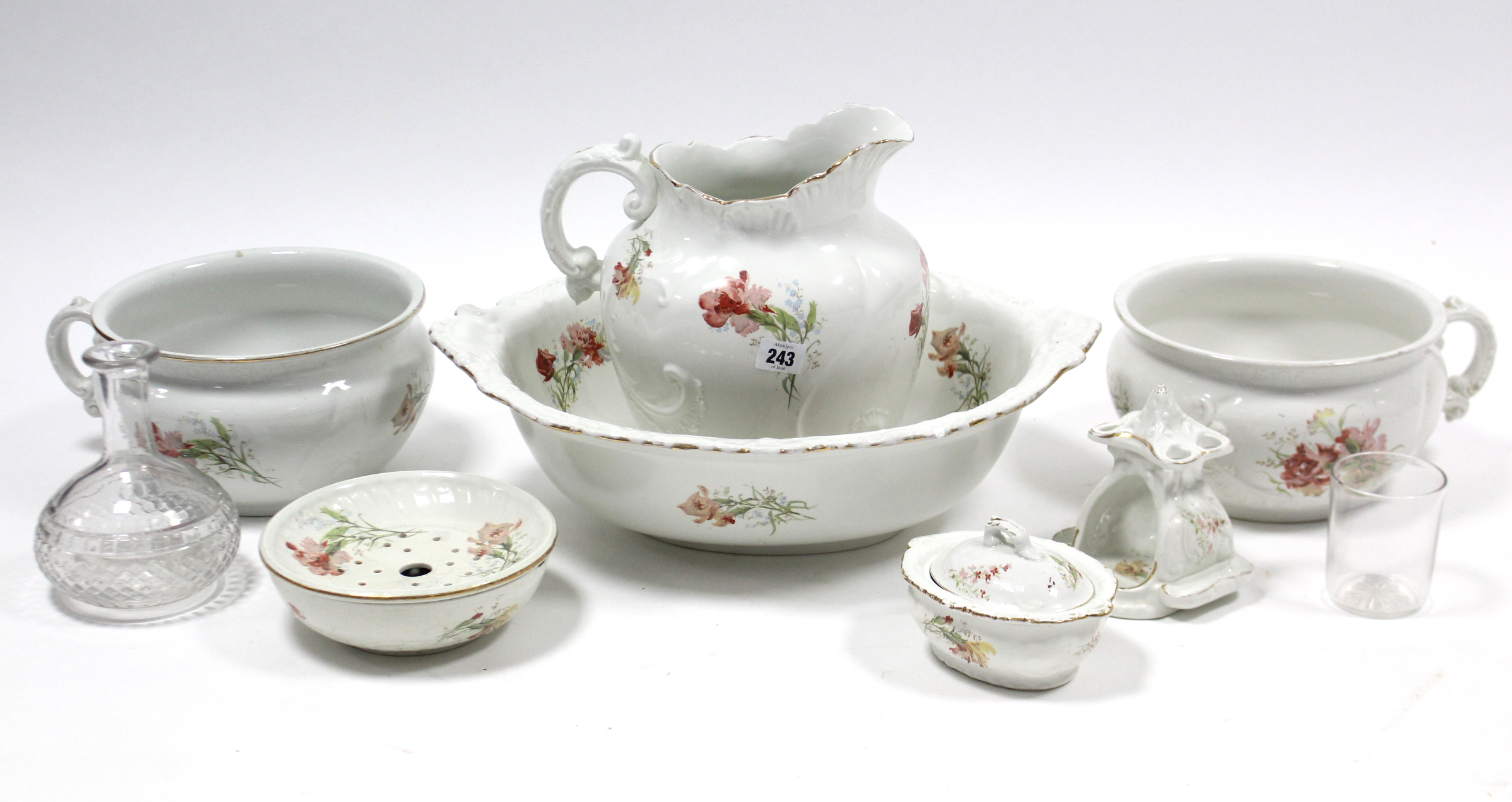 A Booth’s floral decorated eight-piece toilet set; a glass decanter; & a glass tumbler, part w.a.f.