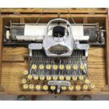 An American early/mid-20th century Blickensderfer aluminium featherweight portable typewriter,