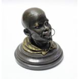 An Austrian-Vienna cold painted bronze novelty inkwell in the form of an African male head,