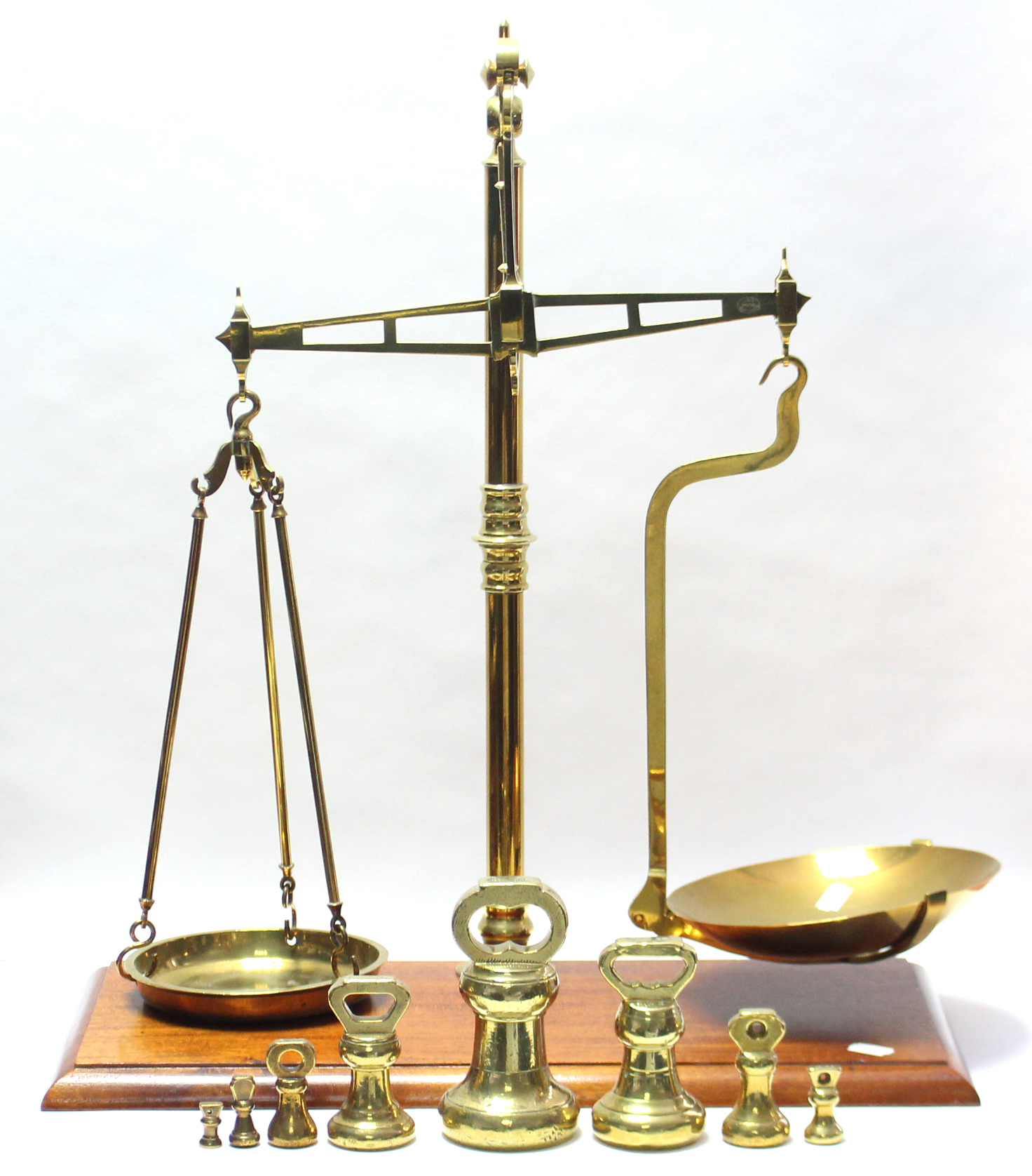 A similar brass counter-top beam scale stamped "G.W.S. Makers, Manchester", with eight brass bell-sh