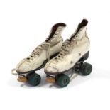 A pair of Hamaco “Super Sportsman” roller skates (sixe 6); together with three cane fishing rods.