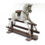 A LATE 19th/EARLY 20th CENTURY DAPPLE GREY PAINTED WOODEN ROCKING HORSE ON TRESTLE BASE (W.A.F.),