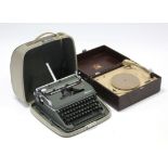 An HMV portable record player in brown fibre-covered case; & an Olympia “Deluxe” portable