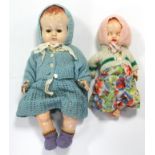 Two Pedigree celluloid baby dolls, 14”, & 9½” tall, both dressed.