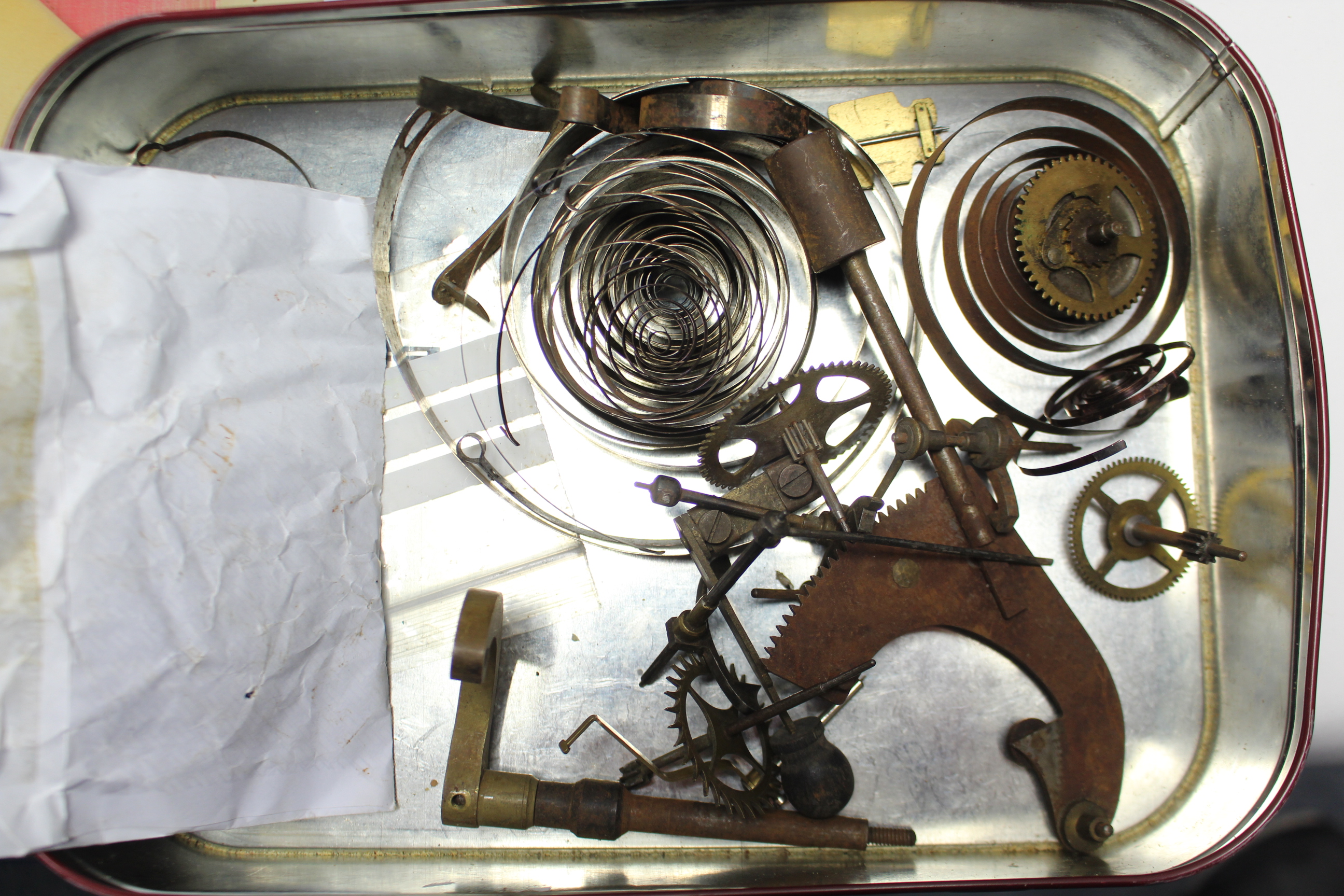 An early 20th century mantel clock mechanism with white enamel dial, 4¼” diameter; & various clock - Image 4 of 4