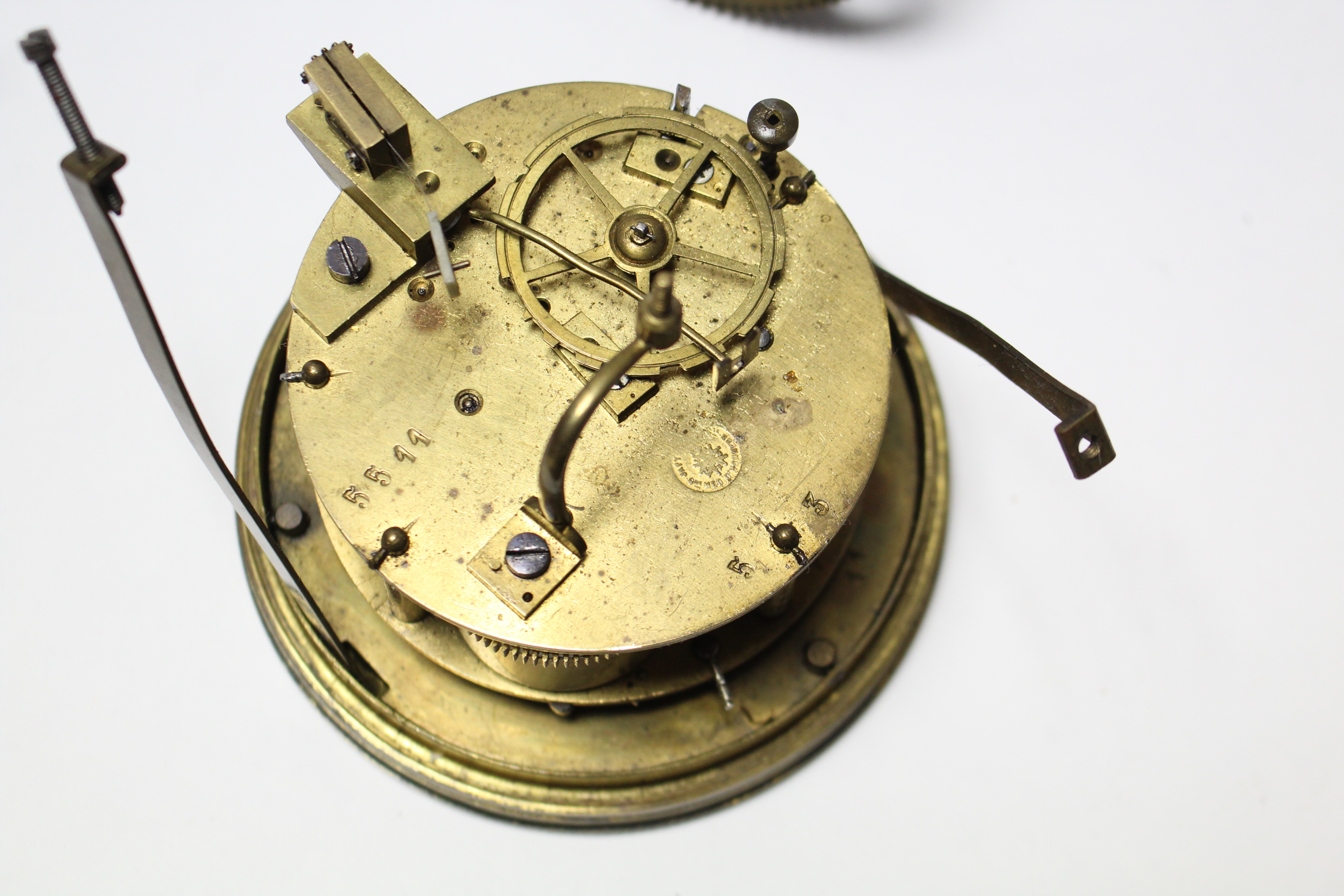 An early 20th century mantel clock mechanism with white enamel dial, 4¼” diameter; & various clock - Image 3 of 4