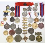 A collection of commemorative medals, badges, etc.