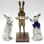 A brass novelty ornament in the form of a standing character rabbit mounted on walnut plinth base,