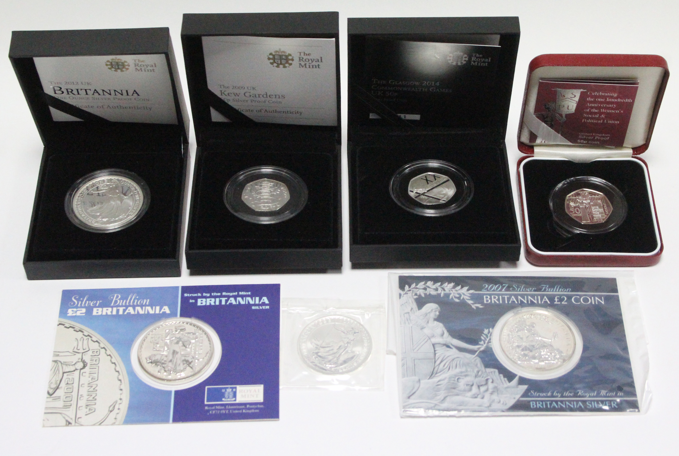 Four Royal Mint “Britannia” silver large £2 coins, 1998, 2001, 2007, & 2012; & three Royal Mint