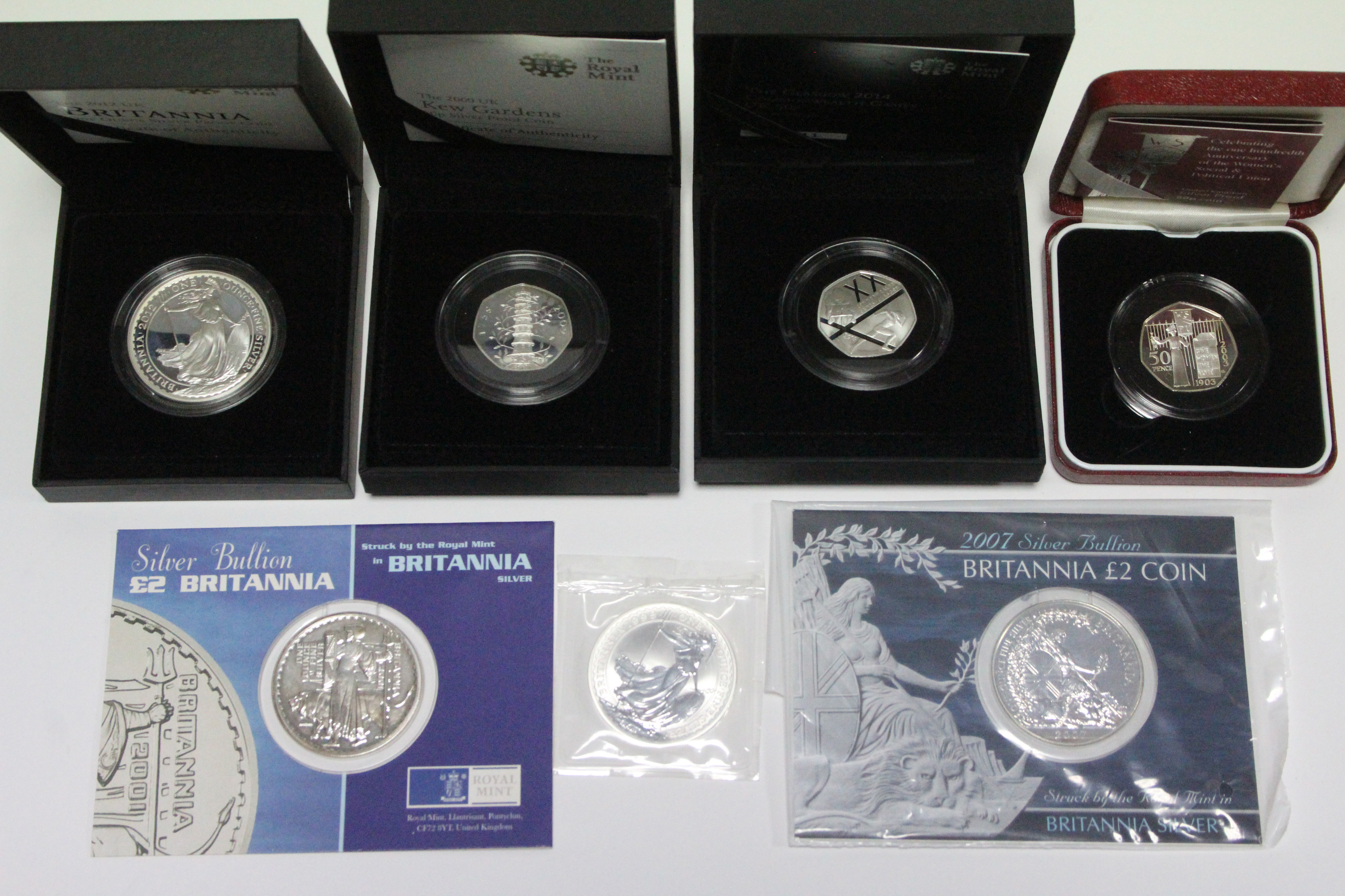 Four Royal Mint “Britannia” silver large £2 coins, 1998, 2001, 2007, & 2012; & three Royal Mint - Image 2 of 2