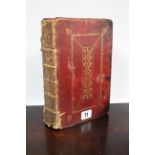 An 18th century Common Prayer Book in gilt-tooled crimson leather binding.