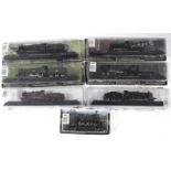 Seven Amer Co. scale model locomotives, each with window box.