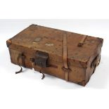An early 20th century tan leather & steel-studded travelling trunk with hinged lift-lid & with