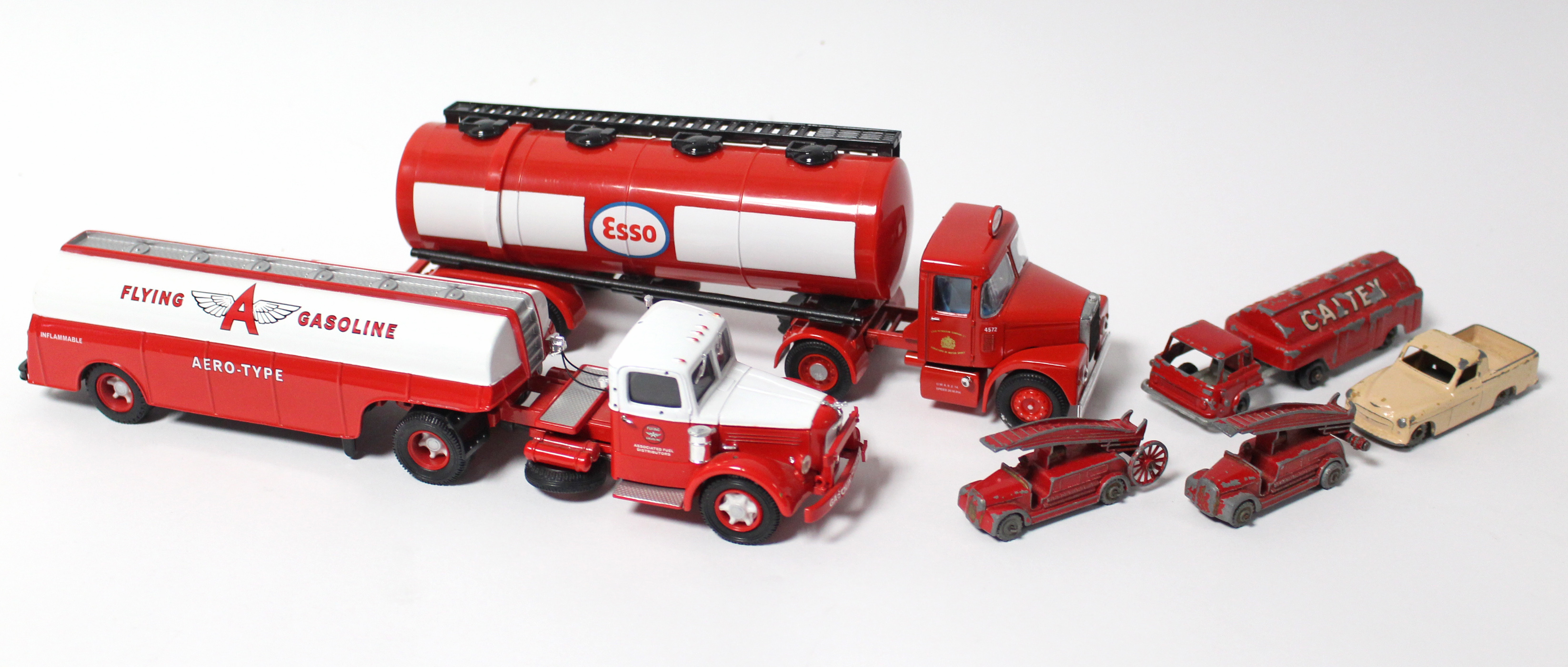 Two Corgi scale model petrol tankers; & four various small die-cast scale models, all unboxed.