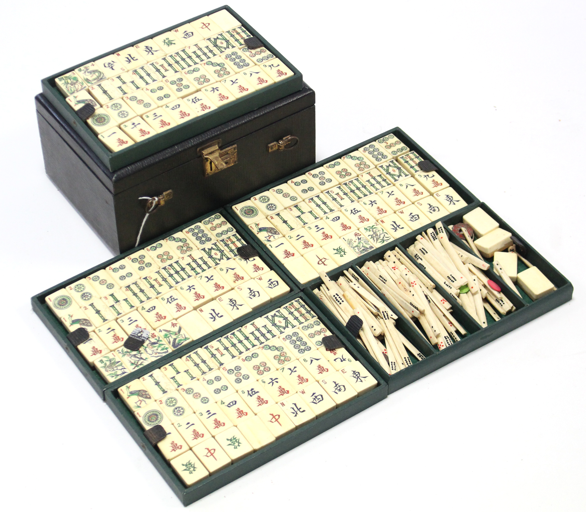 A mid-20th century bone mah-jong set with black morocco leather case.