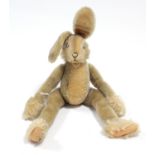 A Steiff rabbit soft toy with button to ear, 18” high.