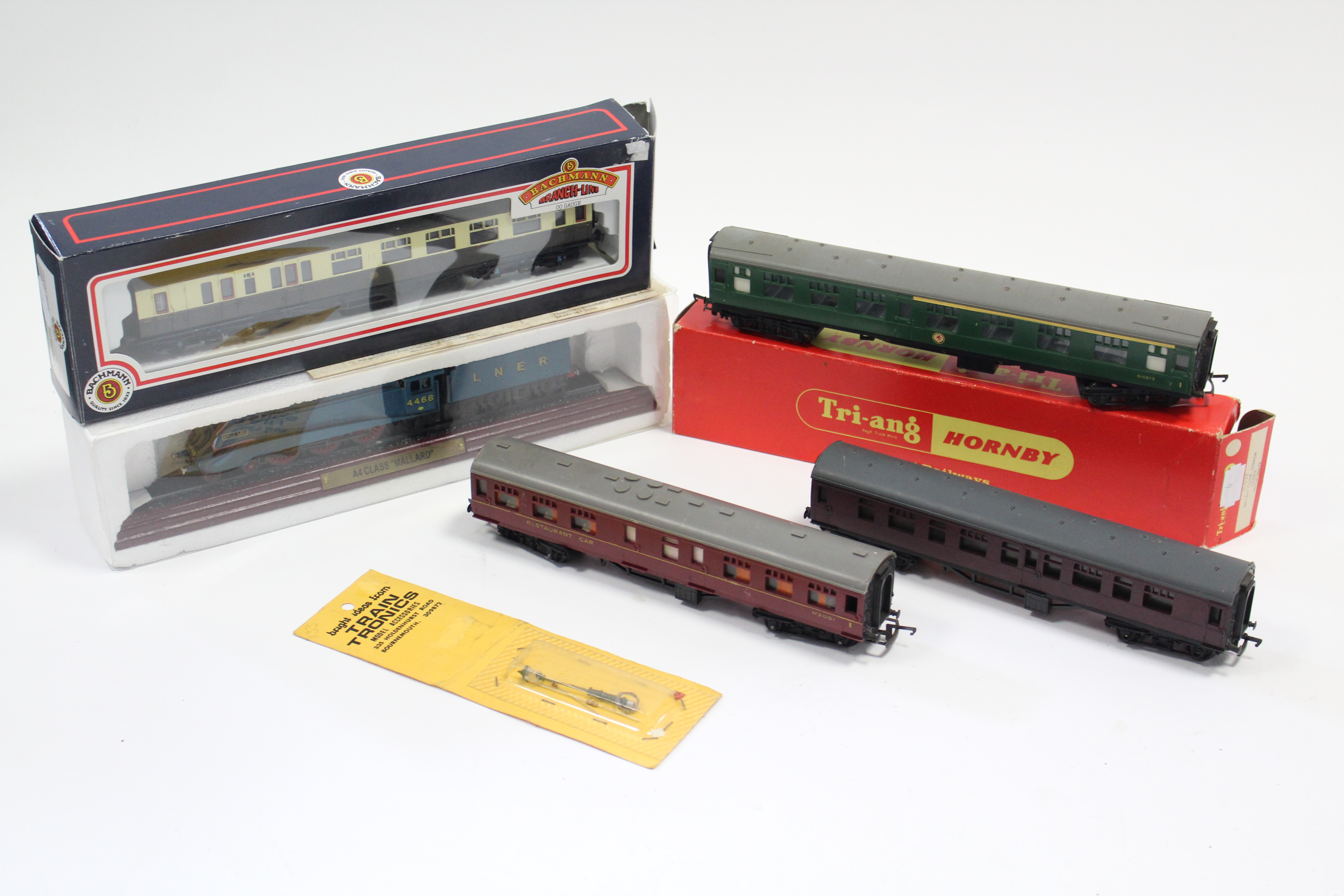 A Bachmann “OO” gauge model G.W.R. coach; a Tri-ang/Hornby “H0/00” gauge model coach; a scale