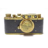 A replica "Luftwaffen Eigentum" 50mm brass-finish camera (No. 724), uncased.