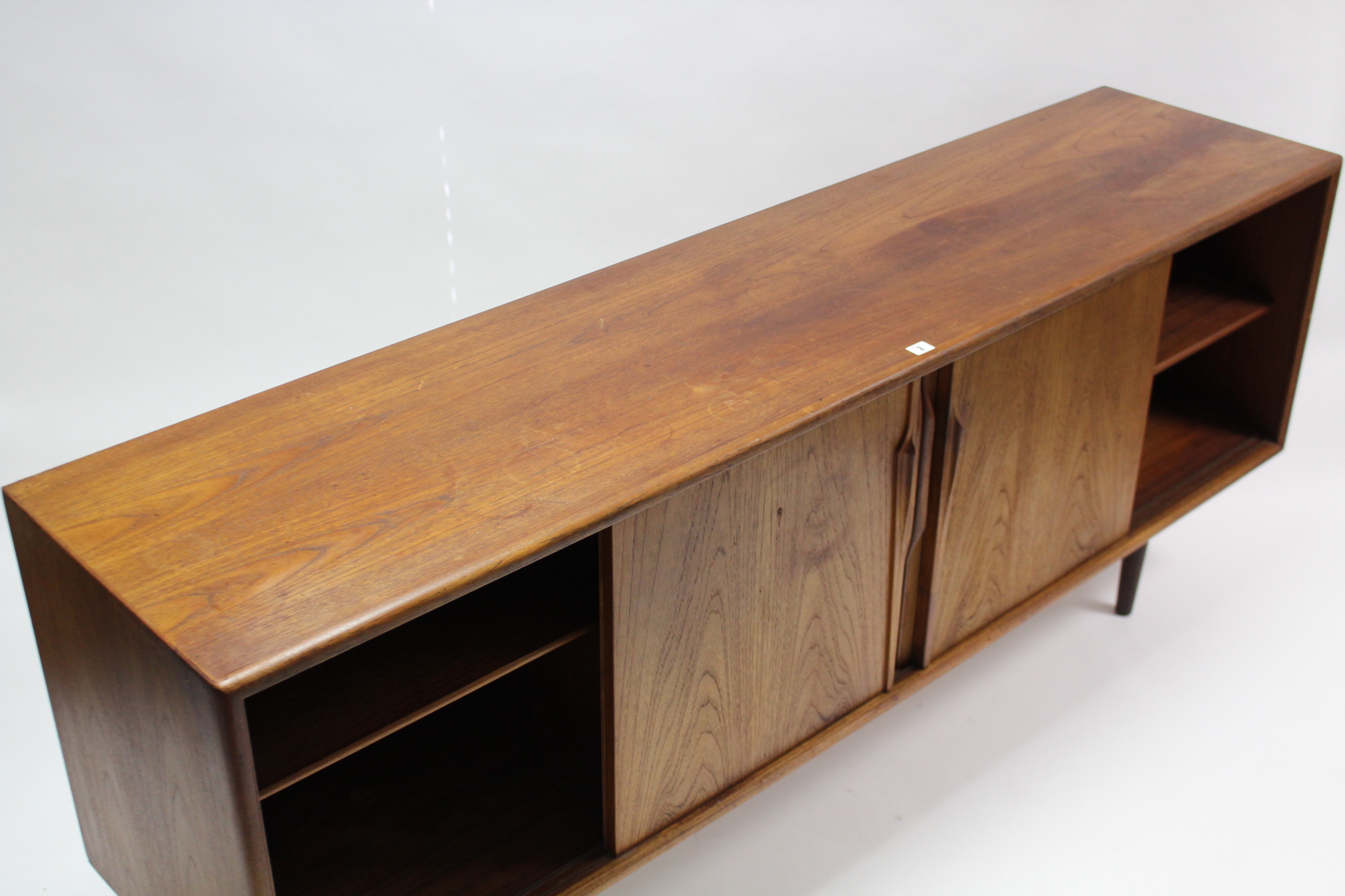 A 1960’s teak sideboard with fitted interior enclosed by two pairs of sliding panel doors, & on - Image 6 of 7