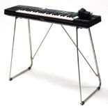A Yamaha “PSR-22” electric keyboard, with stand.