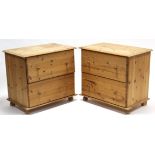 A pair of pine dwarf filing chests each fitted two long drawers with turned knob handles, & on