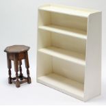 A white painted wooden four-tier standing open bookcase, 30” wide x 35” high; together with an oak