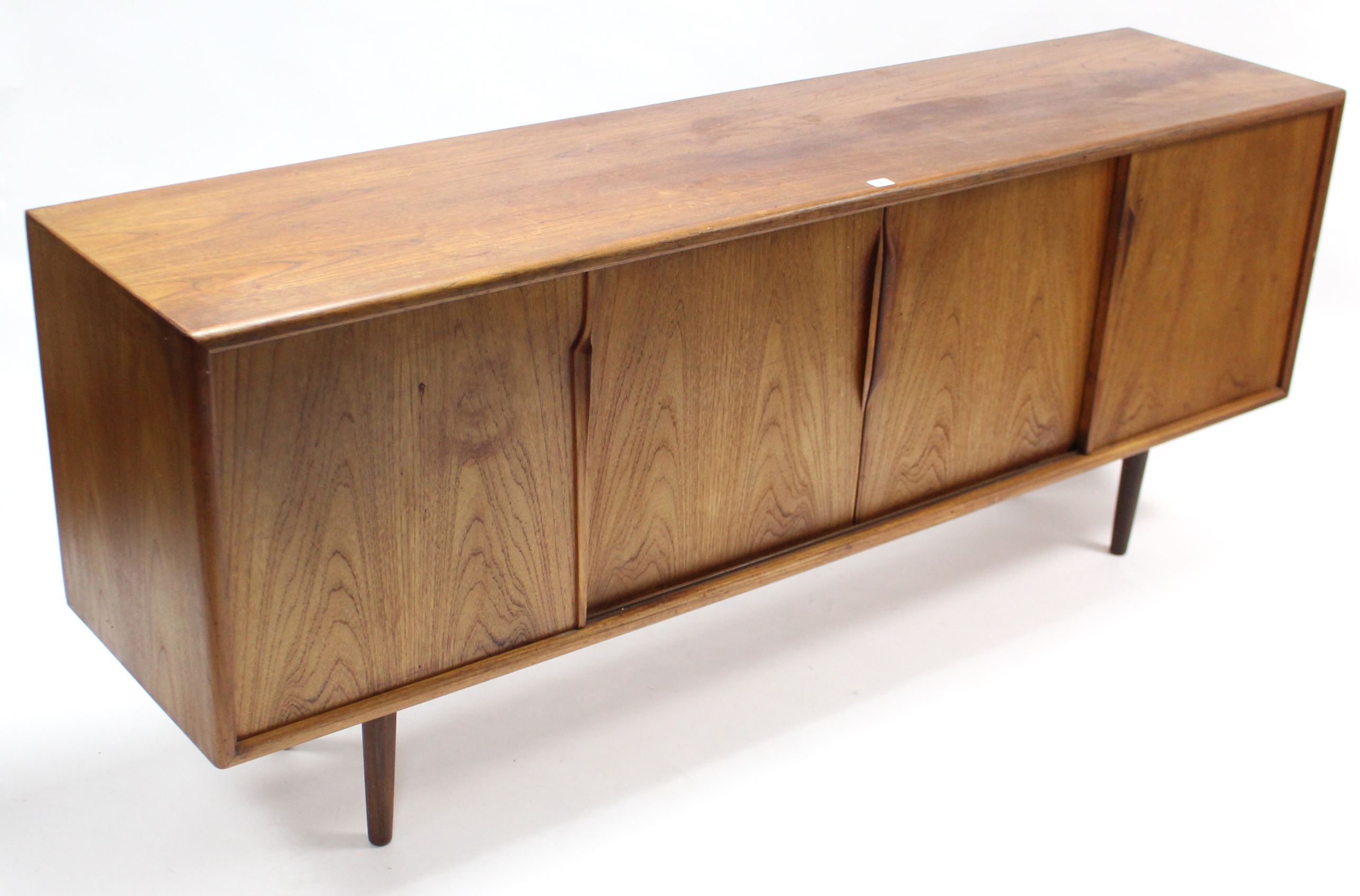 A 1960’s teak sideboard with fitted interior enclosed by two pairs of sliding panel doors, & on - Image 2 of 7
