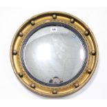 A regency-style gilt frame convex wall mirror with sphere border, 16” diam.; & a copper frame oval