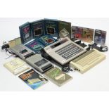 An Acorn Electron computer; a Philips “G-7000” Videopac Computer; various accessories; & two tape