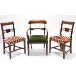 A William IV mahogany bow-back carver chair with open scroll arms, padded drop-in seat, & on