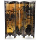 A Chinese black lacquered tall six-fold draught screen inset with figure scene panels, 72” high.