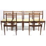A set of six G-Plan teak rail-back dining chairs with padded drop-in seats & on round tapered legs.