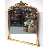 A 19th century-style gilt frame overmantel mirror with rounded top, 55¾” wide x 56” high.