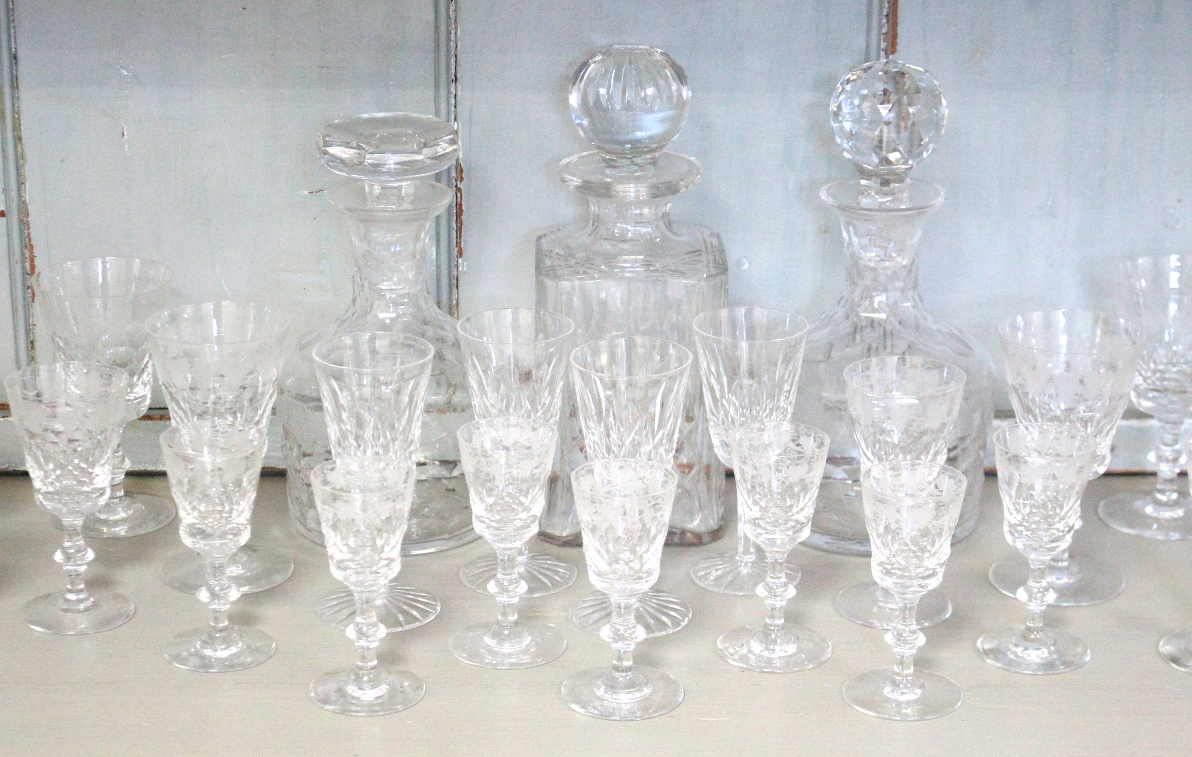 Three heavy cut-glass decanters; & thirty various drinking vessels.