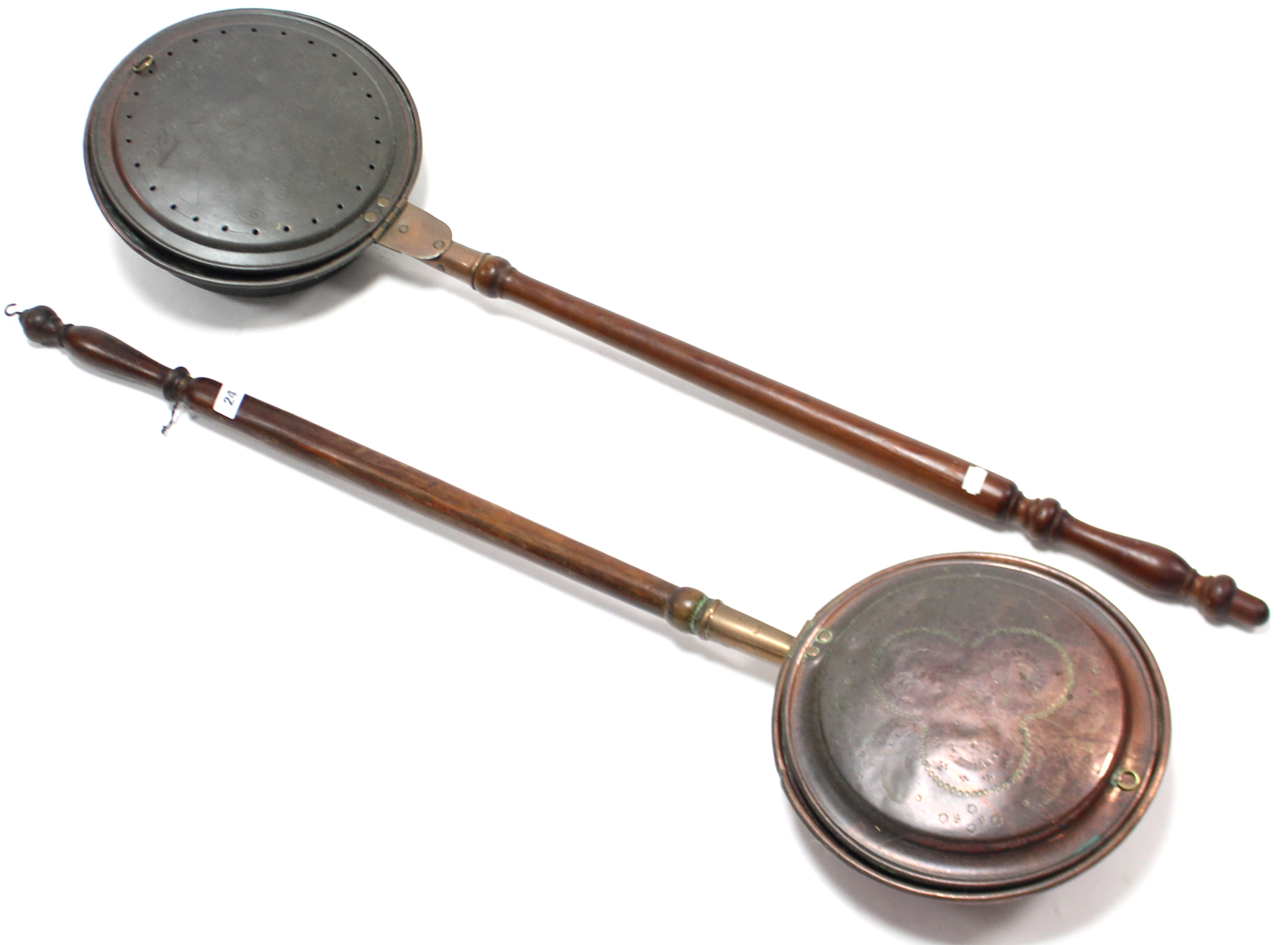 A pair of 19th century copper engraved warming pans, each with long turned wooden handle.